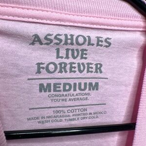 Assholes Live Forever Graphic Long Sleeve Tee – Pink – Men’s Medium